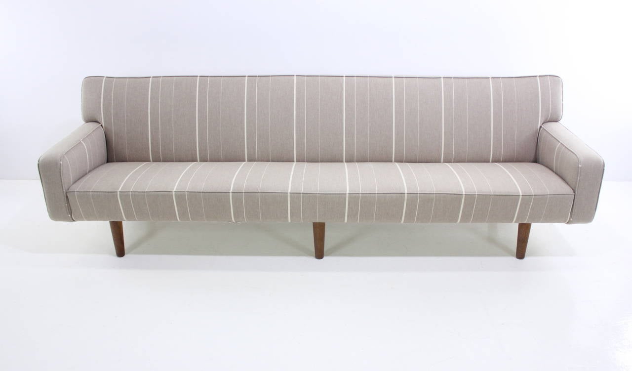 Distinctive Danish modern sofa designed by Hans Wegner.
A.P. Stolen, maker. Model AP33.
Custom designed with extra length in 1959 for Danish architect.
Original 100% wool upholstery. Oak legs.
Matchless quality and price.
Low freight and quick