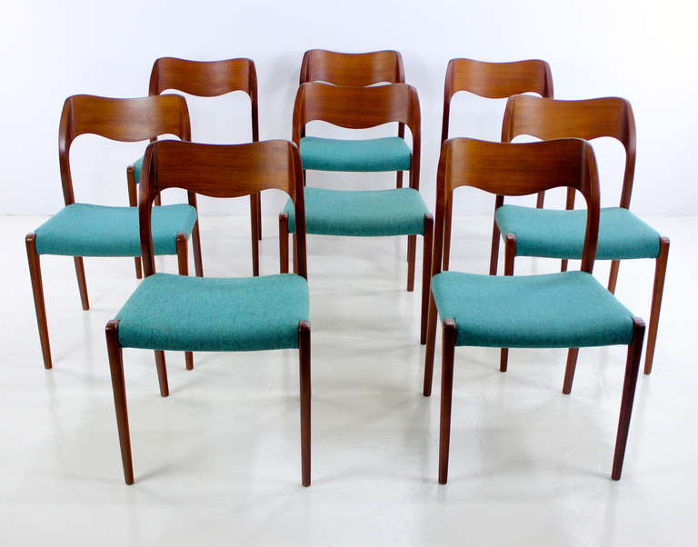 Eight danish modern dining chairs designed by JL Moller, Niels Moller, maker. Model #71.
Beautifully grained teak with highly sculptural backs. Seats upholstered in original custom fabric, Tasinge, 9559.
From immaculate Florida estate, purchased