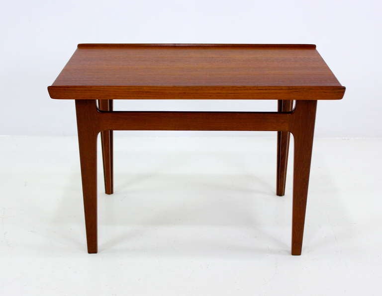 Danish modern side / end table designed by Finn Juhl.
France & Daverkosen, maker.
Solid teak with signature Juhl raised edges.
Professionally restored and refinished by LookModern.
Matchless quality and price.
Low freight, quick ship.