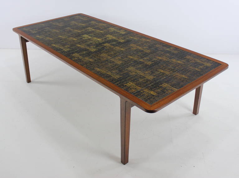 Rare danish modern table designed by Ludvig Pontoppidan. Transitional size allows for variety of applications including coffee table, library table, display table or collector / show piece. Rich teak frame topped with unique Royal Copenhagen tiles