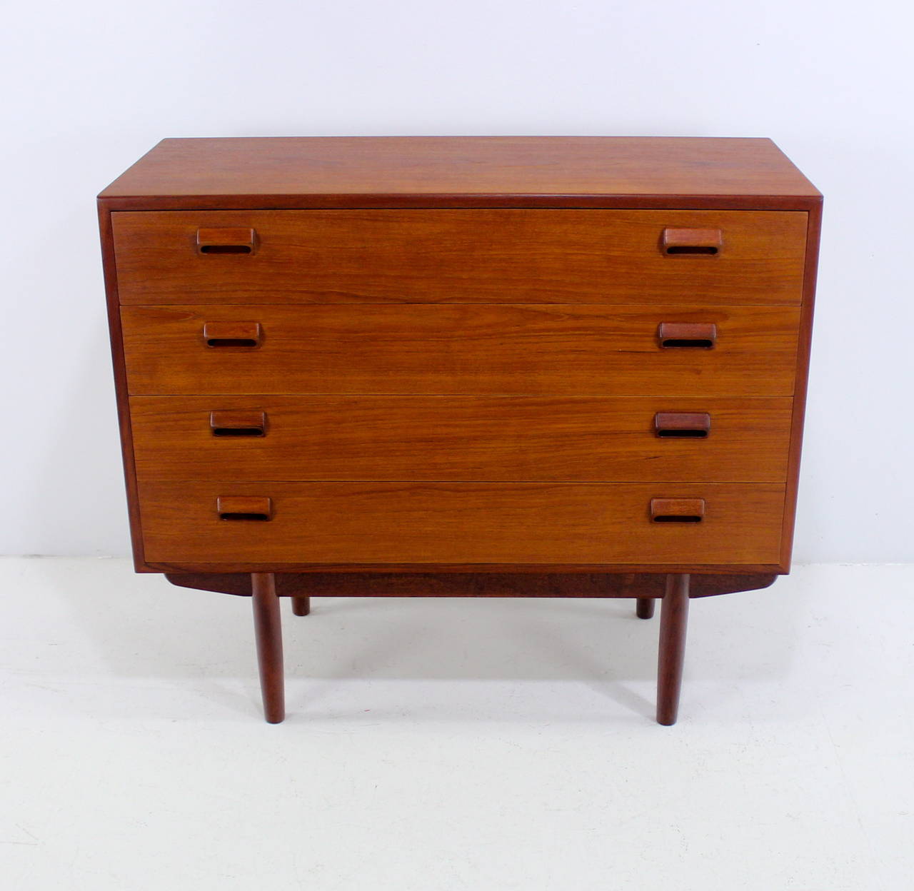 Danish modern dresser designed by Børge Mogensen.
Richly grained teak.
Four drawers with signature Mogensen scupper handles.
Signature Mogensen cross frame base.
Matching vanity listed separately.
Professionally restored and refinished by
