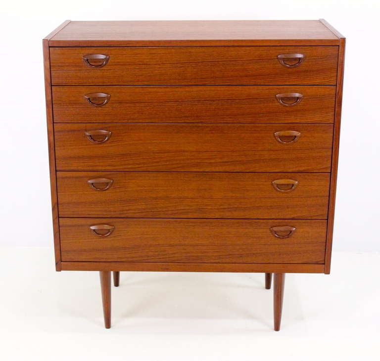 Danish modern teak dresser designed by Kai Kristiansen.
Five drawers with signature Kristiansen cat eye handles.
Professionally restored and refinished by LookModern.
Matchless quality and price.
Low freight, quick ship.