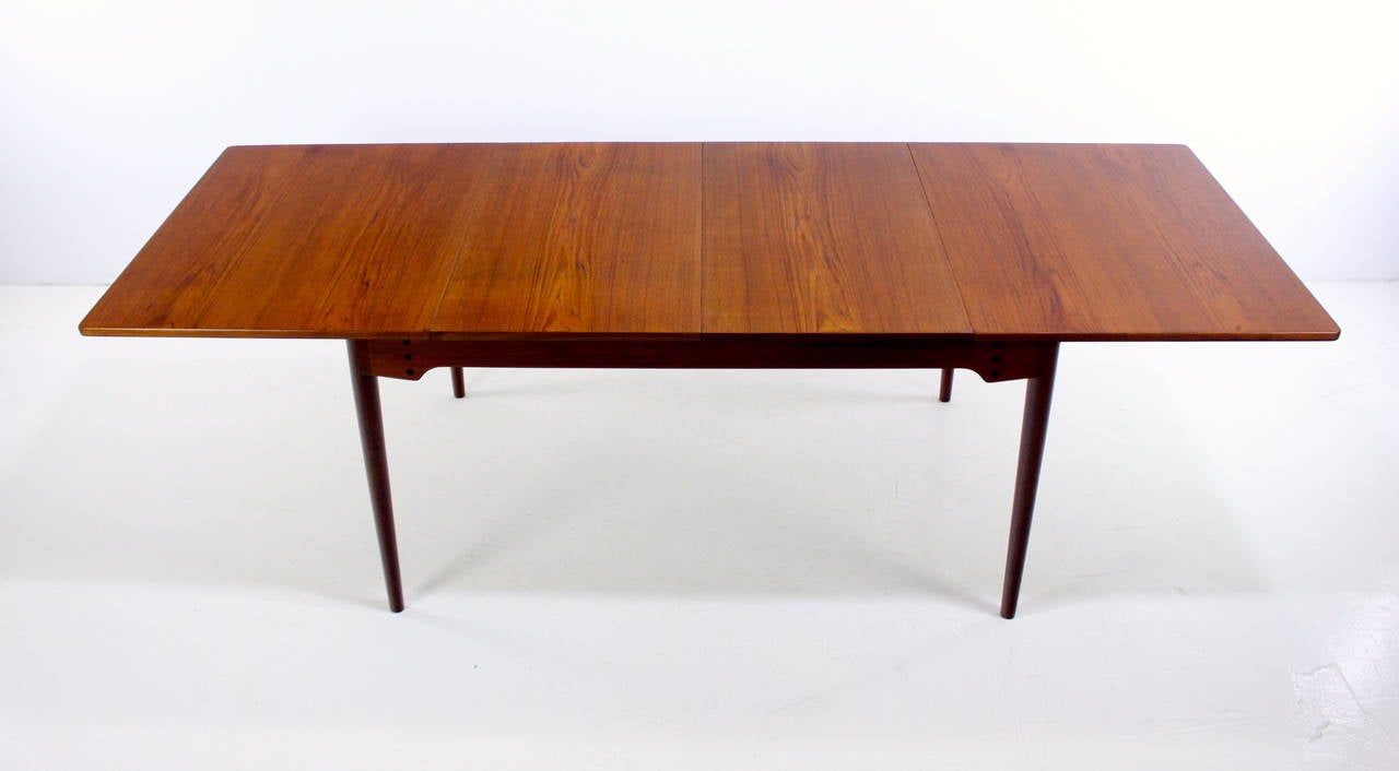 Danish modern dining table designed by Finn Juhl.
Richly grained teak, with uniquely styled skirt.
Highest quality craftsmanship and joinery.
Two 20