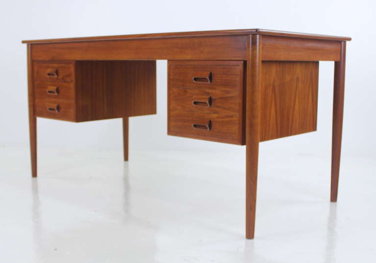 Impressive danish modern executive desk designed in 1952 by Borge Mogensen. Sobler Mobler, maker. Model #130.
Beautifully grained teak with three drawers, featuring signature Mogensen handles, on each side.

Professionally restored and refinished