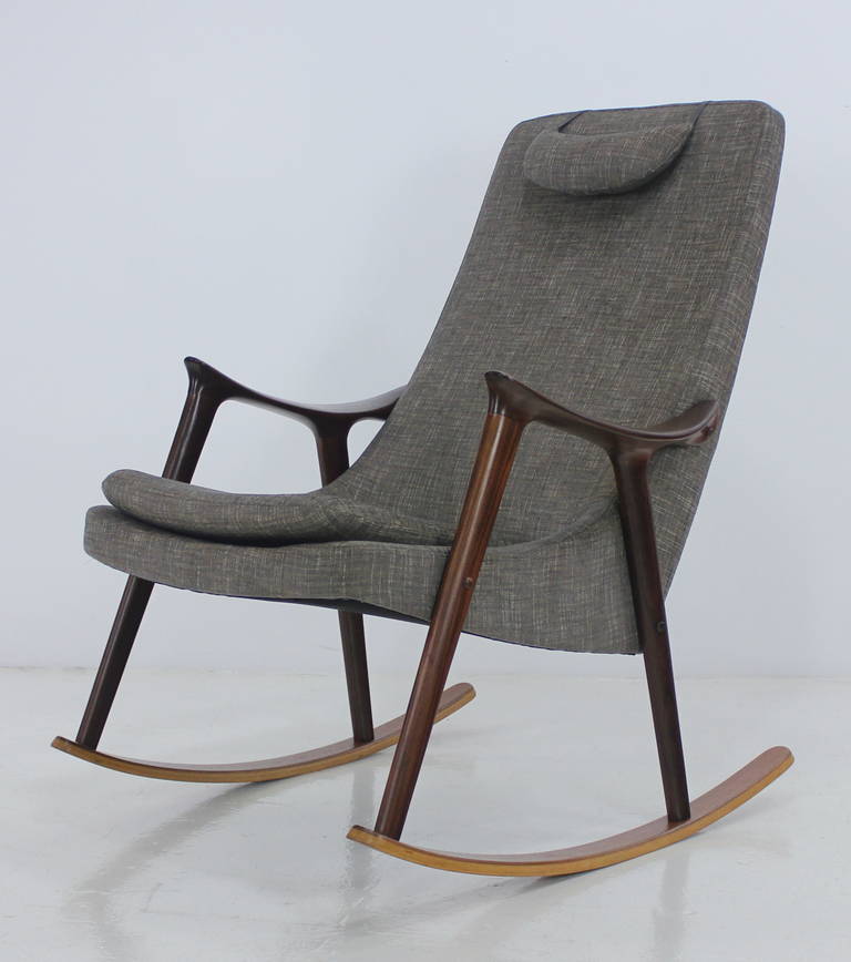 Winsome scandinavian modern rocking chair designed by Ingmar Relling.
Rich teak frame on mahogany rockers.
Detachable weighted headrest.
New foam, newly upholstered in highest quality period fabric.
Professionally restored and refinished by