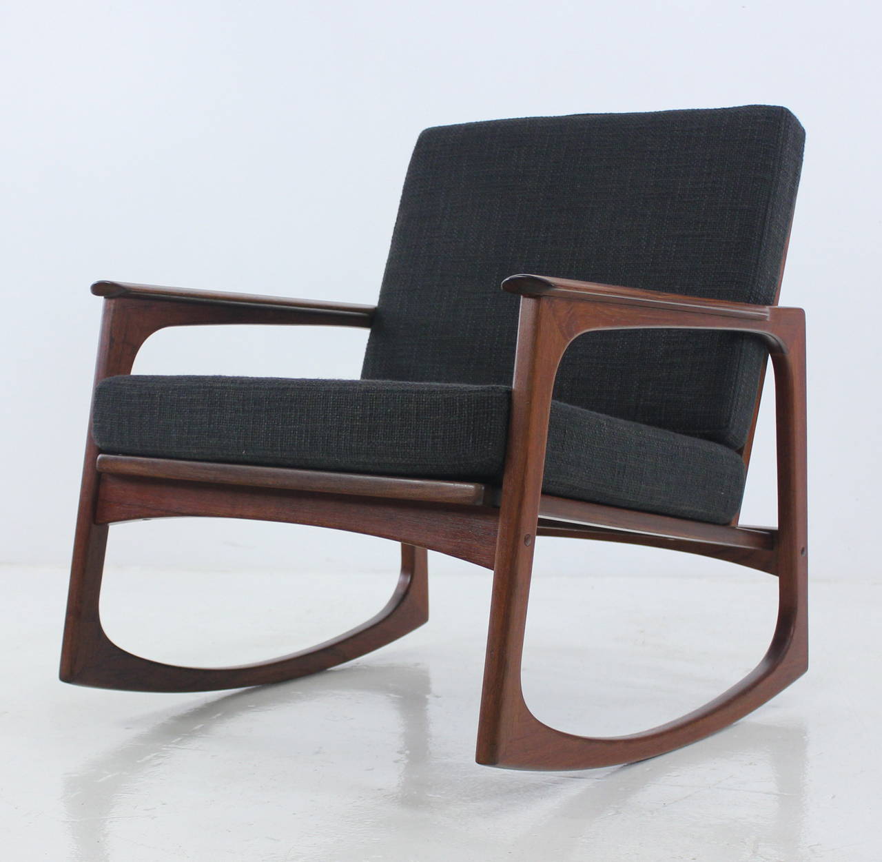 Danish modern rocking chair designed by Jacob Kjaer.
Timeless style and comfort.
Rich teak frame.
New foam cushions newly upholstered in highest quality period fabric.
Professionally restored and refinished by LookModern.
Matchless quality and