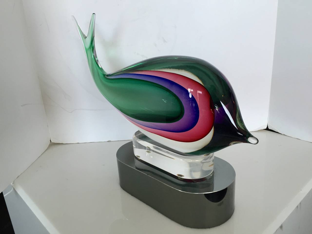 Beautiful Murano Glass Fish by Luigi Onesta. Resting on lucite and wrapped steel base. Signed on underside.