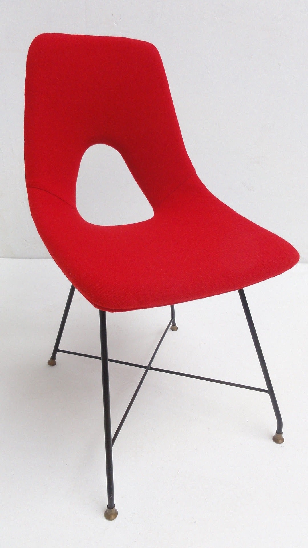 This single side chair by Augusto Bozzi for Fratelli Saporiti is newly upholstered in a red wool Kvadrat fabric.

Metal base has been polished and left in its original vintage condition to authenticate the vintage character of this eye-catching