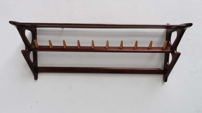 A beautiful large organic shaped wall mounted coatrack produced or imported in Holland in the 1950's.

The coatrack is carved from solid walnut wood with solid birch hooks

The organic lines are reminiscent to the early 50's Italian designs by