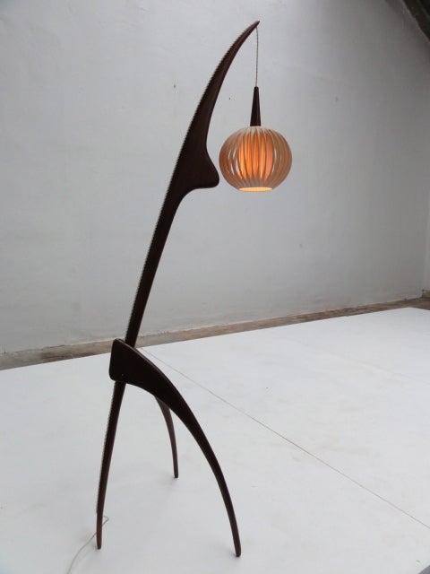 A stunning Praying Mantis floor lamp by Rispal, France
Solid carved walnut tripod base with the original rispal rhodoid shade that is adjustable in height
The lamp has been rewired and is in excellent condition

During the early 1950s the french