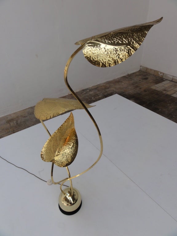 A rare and  very hard to find pair of freeform brass foliage floor lamps by Angelo Lelli for Arredoluce Italy,
Three entwined brass arms finished with delicate exquisitely detailed impressed brass leaf  form shades cojoined into a weighted  semi