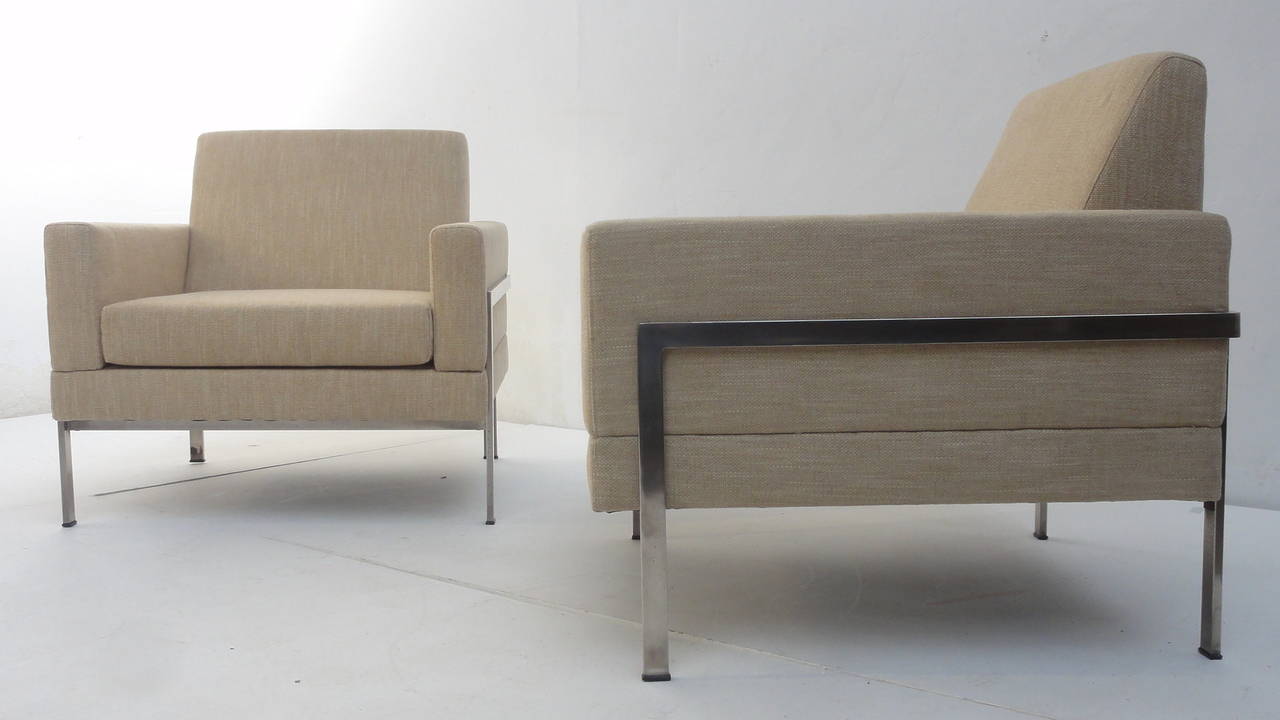 Nice pair of cubic lounge chairs attributed to German manufacturer Walter Knoll.

They have been newly upholstered in a cream/gold Ploeg fabric and new foam.

The nickel-plated metal base has been polished and shows signs of chrome loss from