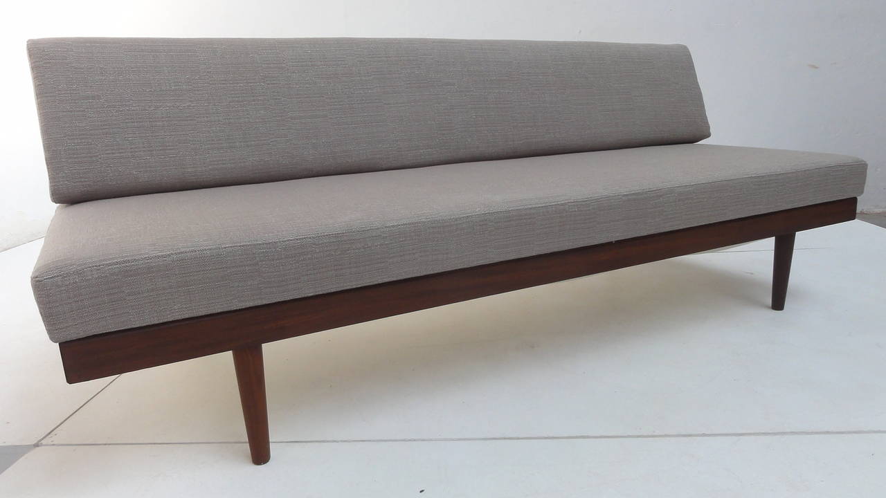Lovely Mid-Century sofa, bed or daybed with storage compartment for e.g. blankets.

This solid teak frame Scandinavian beauty was made in Norway (stamped) but of unknown designer.

The sofa is newly upholstered in a top quality van der Ploeg