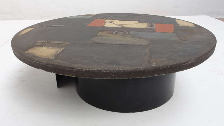 A beautiful and Signed Paul Kingma signed round coffee table

Paul Kingma is a well known Dutch sculpture artists born in 1931 who made most of his tables between 1970 and 1994, he started making tables in the early sixties for friends. 
All