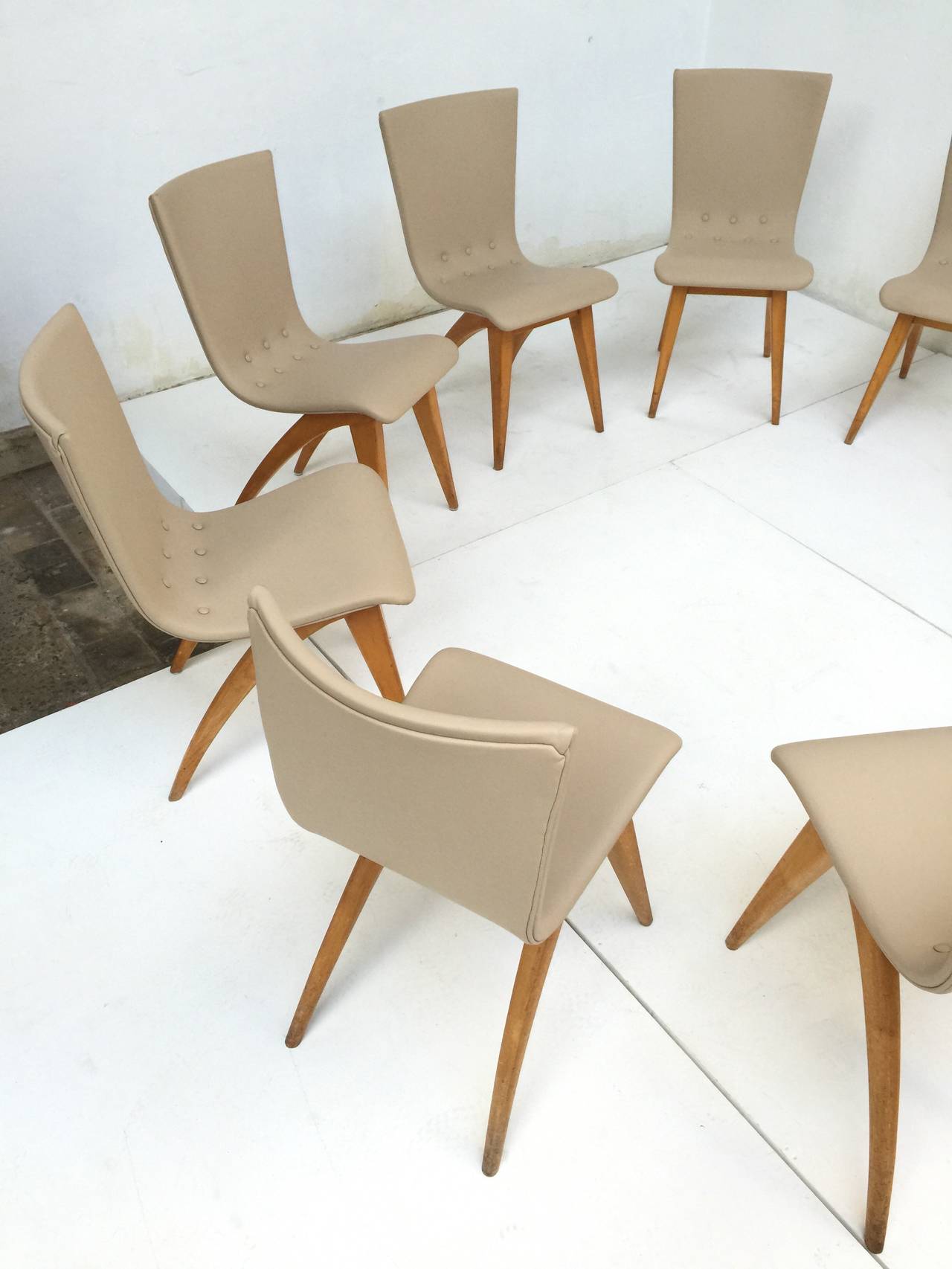 The design of this chair by Dutch designer C. J. Van Os who owned his own furniture company in Culemborg dates back to 1949 and was in production during the 1950s.

The chairs are of great quality with nice organic solid birch legs and new genuine