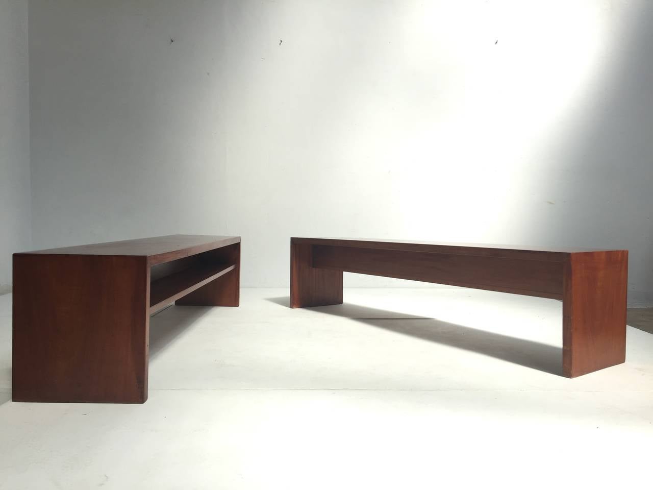 This unique pair of solid mahogany benches comes from a Church by Dutch Architect Harry Nefkens build in 1963 in Bergen op Zoom, The Netherlands
 
Nefkens was clearly inspired by the works of American architect Frank Loyd Wright and created a few