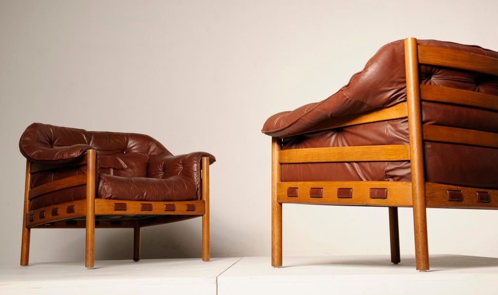 A pair of very comfortable leather easy chairs by Swedish designer Arne Norell.