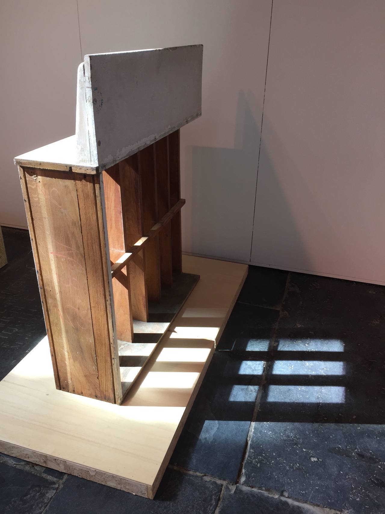 A salvaged oak wall integrated 'Brise Soleil' from the Le Corbusier's Unite d'habitation in Marseille.

The Brise Soleil was build in the wall on the second level to function as a ventilate and get extra light in the room, some were taken out