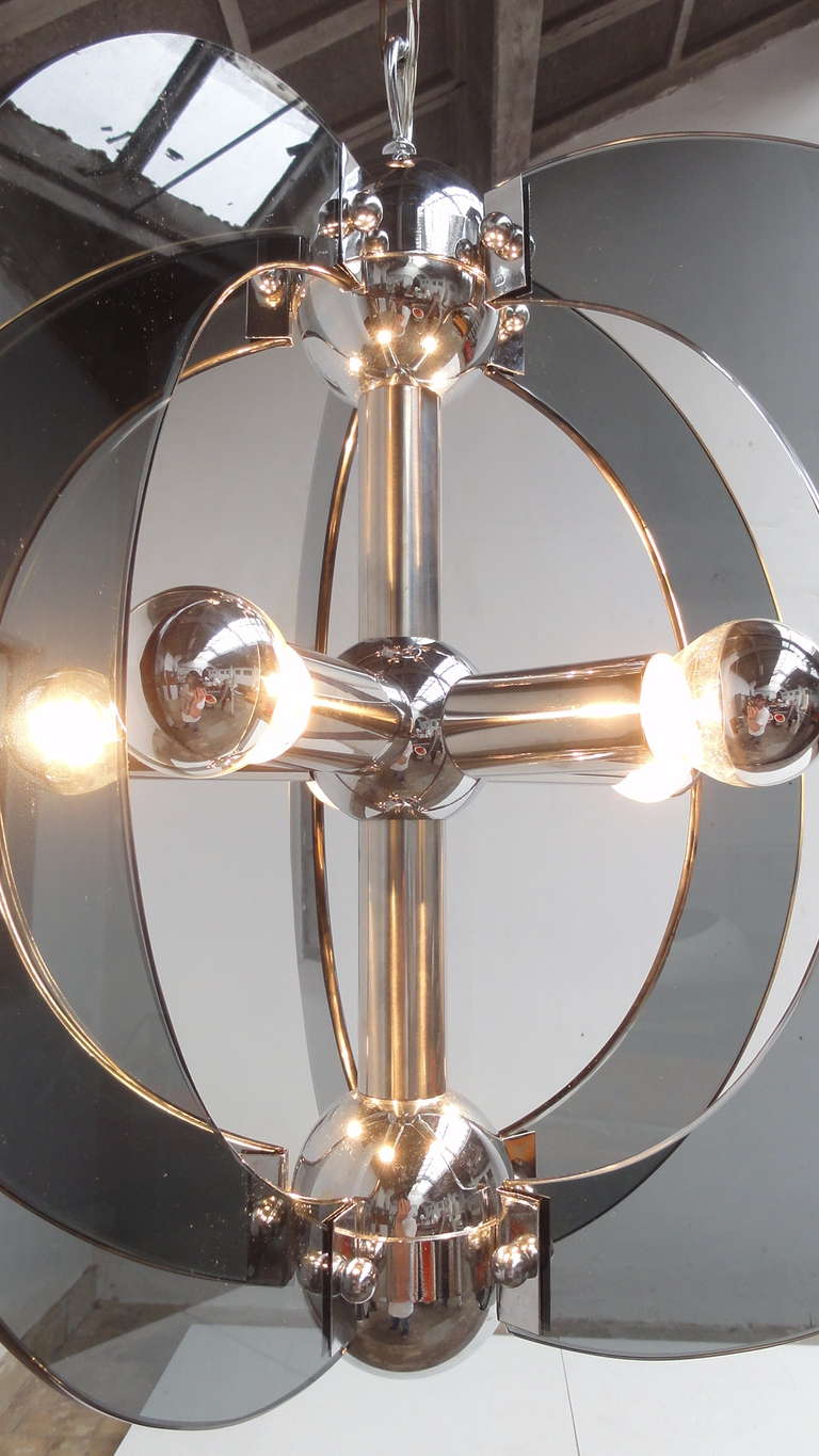 Stunning large glass sphere glass and chromed steel Italian chandelier  in the style of Fontana Arte.
Dating back to the early 70's the creator of this lamp must have been inspired by the Space Age and the landing on the Moon in 1969
5 pieces of