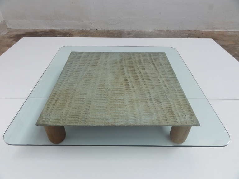 Beautiful organic form sculptural coffee table produced in the mid 1960s by famed italian artist  and sculptor Lorenzo Burchiellaro (1933-).

 The main expressive, sculptural  form ,which supports the protective glass table top is cast in