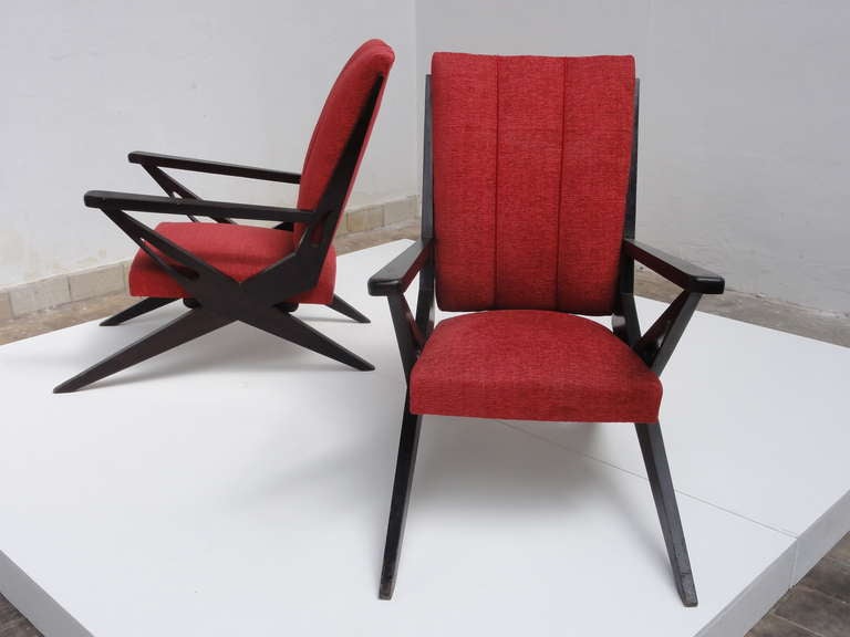Exceptional Italian lounge chairs from the 1950s period. In all our experience in the field of Italian design and applied arts we have never come across this particular model before. The scissor form legs initially remind us of Pierre Jeanneret's