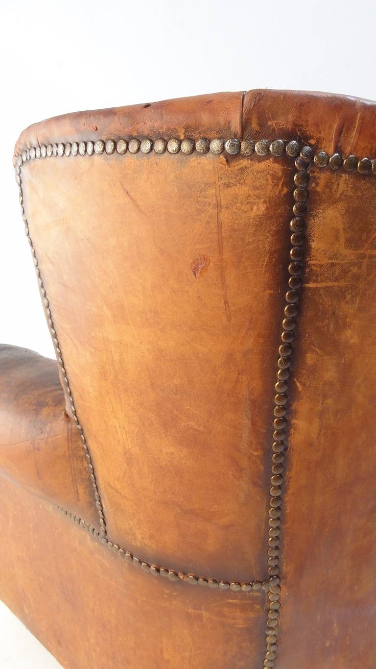 Mid-20th Century Beautiful Distressed Vintage Leather French Deco Wingback Chair with Character