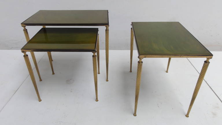 A very nice set of classic solid brass nesting tables with acrylic tops with green marbled effect

The tables are reminiscent to the works of Aldo Tura 

Patina to laquered brass finish

Measurements listed for largest table