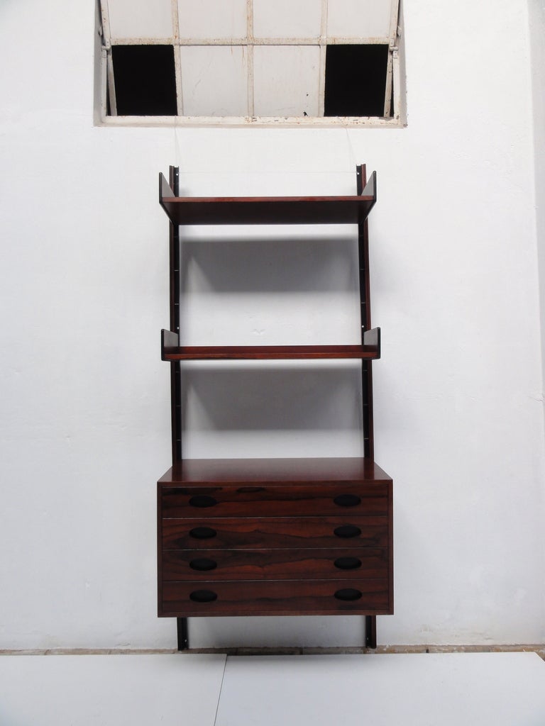Stunning and extremely rare wall mounted   rosewood shelving and drawer unit  from the 
