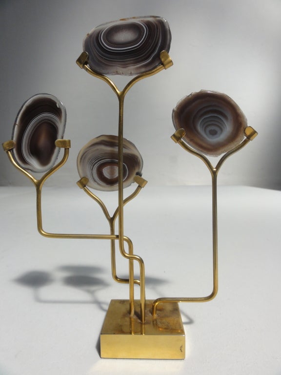 A decorative sculpture by Belgian artist Willy Daro
4 agate slices set in brass that can be adjusted by rotating the rods