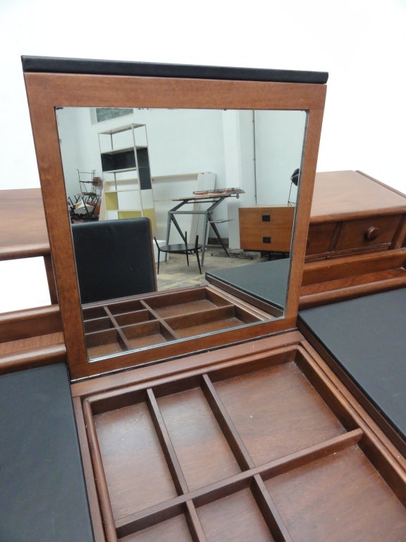 Walnut  and leather, flexible ladies  dressing  or writing table with matching chair designed by FABIO LENCI (1935- ) for Bernini ,Italy , 1980. Signed with original Bernini tag to inside of compartment and underside of chair.

Fabio Lenci’s 22