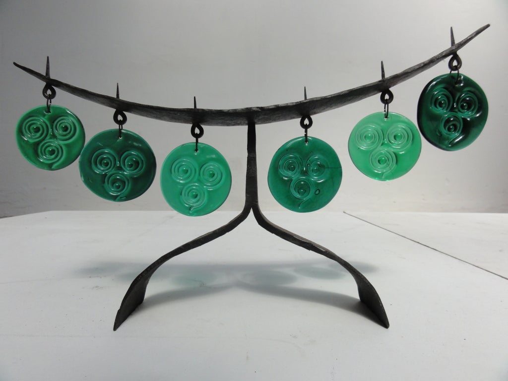 A decorative wrought iron candelabrum with the distinctive glass by Eric Hoglund for Boda Sweden