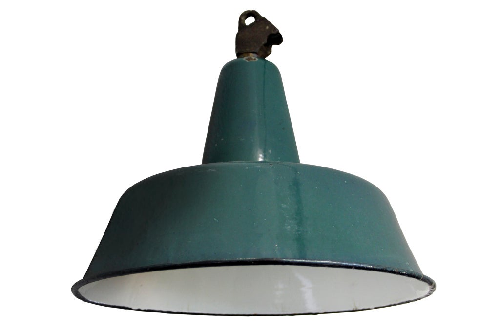 Vintage industrial hanging lamp. Green enamel with white interior. Cast iron top. Weight | 2 kg. Several pieces in stock. Priced individually.

All lamps have been made suitable by international standards for normal light bulbs, energy-efficient
