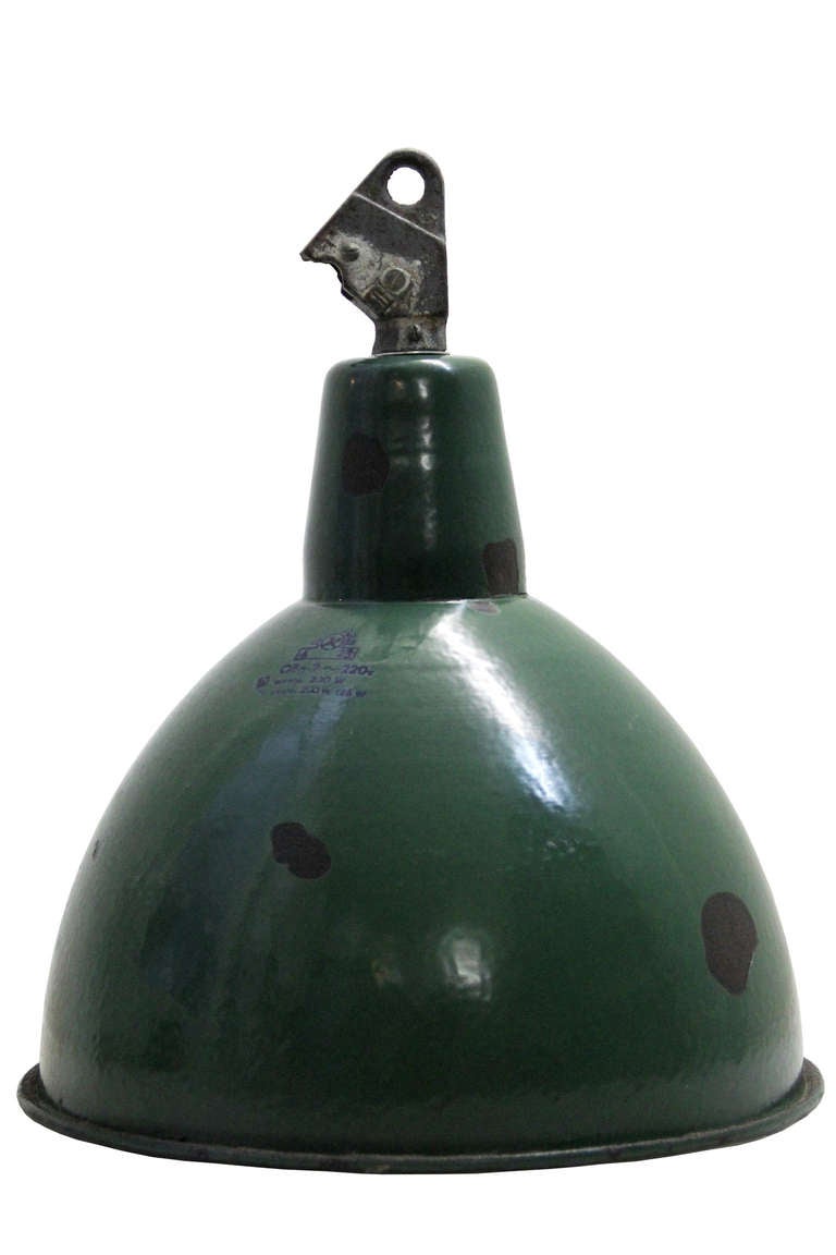 Vintage industrial hanging lamp. Green enamel with white interior. Cast iron top. Weight | 2.0 kg / 4,4 lb.

All lamps have been made suitable by international standards for incandescent light bulbs, energy-efficient and LED bulbs with an E27
