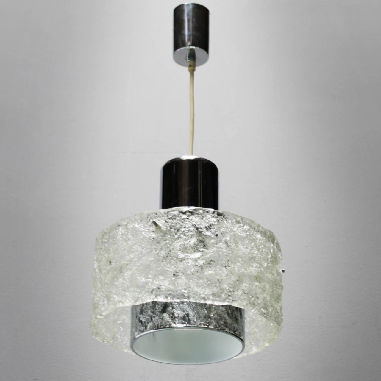 Pendant in the style of Kalmar. Frosted 'ice' glass and chrome.