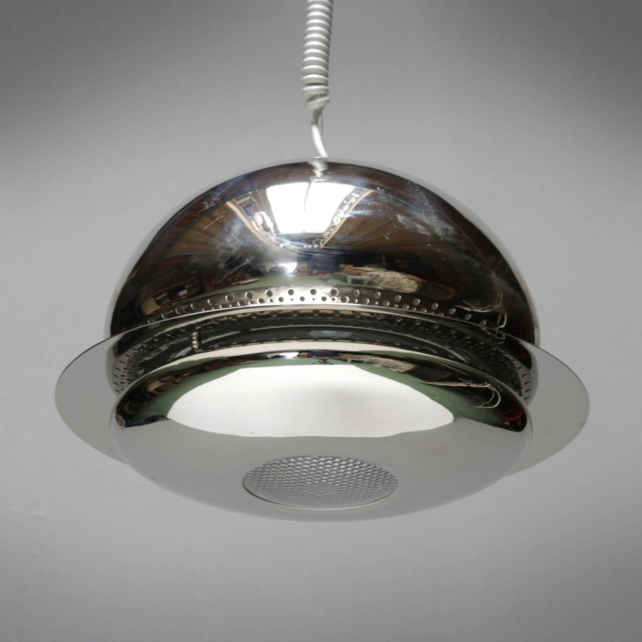 Unique Pendant Light by Afra & Tobia Scarpa. Like new, comes in original box. Chrome plated metal and glass diffuser lens.

The Nictea ceiling fixture was one of the first models ever produced by the famous Italian lighting company Flos.