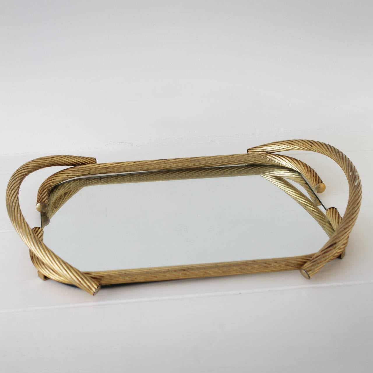 Rope mirror serving tray from France. Gilded metal. Measurements: height 3.5 in. (9 cm), length 21.6 in. (55 cm), width 15.7 inches (40 cm).