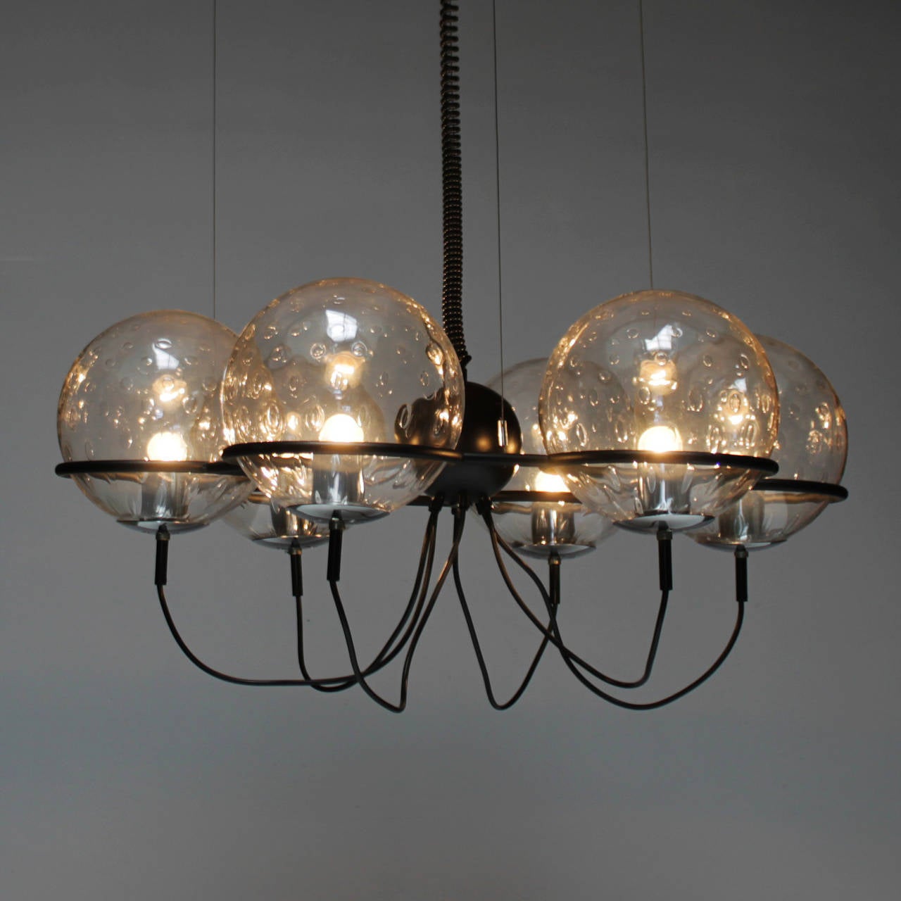 Saturnus chandelier by RAAK, Holland. Designed in the manner of Gino Sarfatti. Six glass globes each with a diameter of 10 inches. Adjustable height.