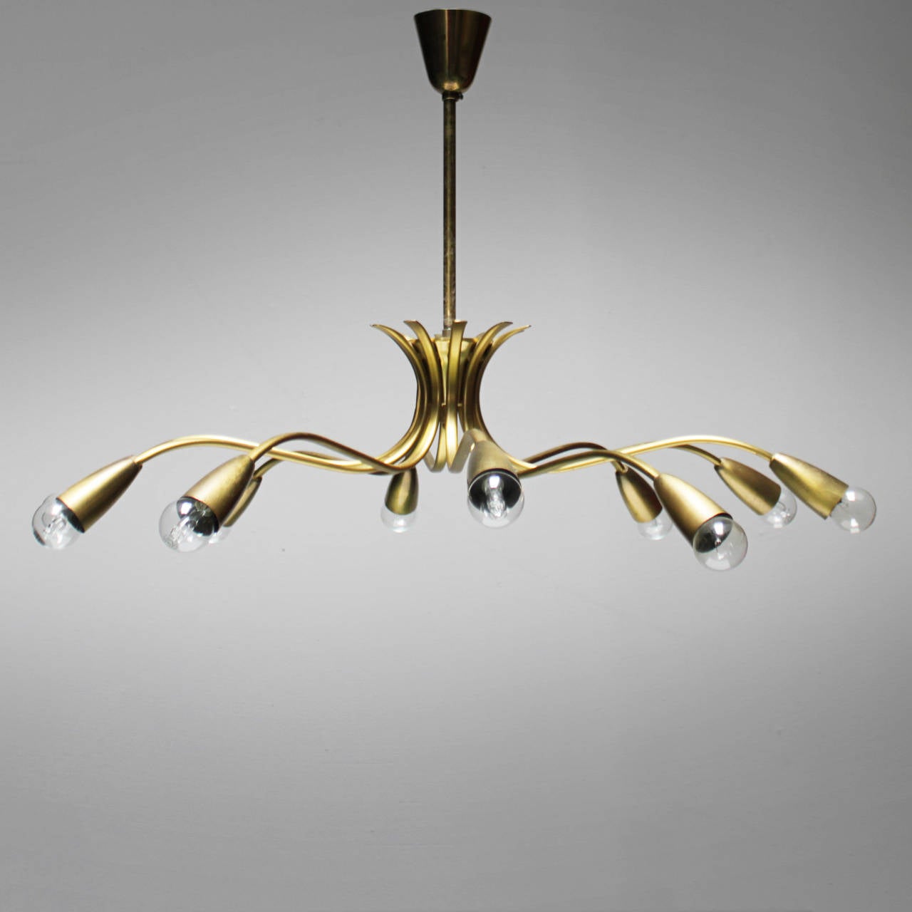 Highly decorative large 10 light fixture in the style of Guglielmo Ulrich. Most likely of Italian origin.