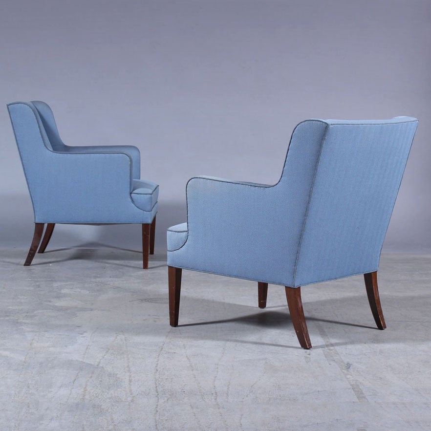 Sofa and a pair of chairs attributed to Frits Henningsen. The two-seat sofa is in a good condition, the armchairs needs attention. One chair has a hole, the other wear at the armrests (see pictures). Upholstered in original blue fabric, tapered