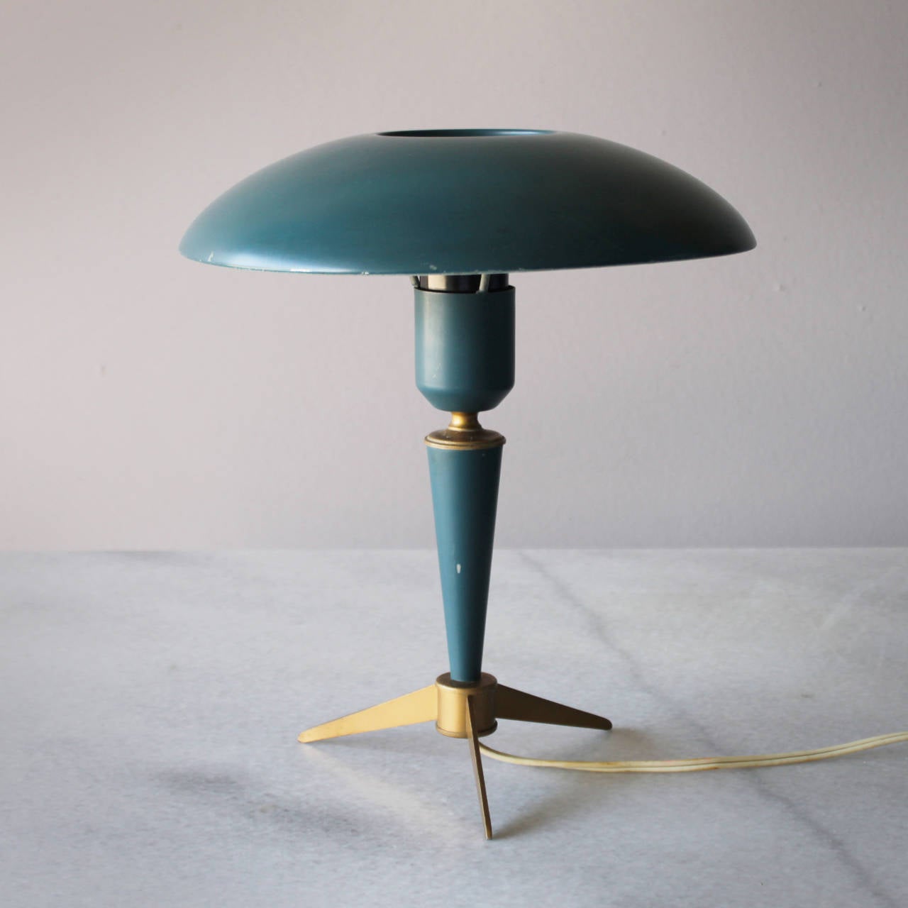 Three tripod table lamps by Louis Kalff for Philips, Dutch, 1950s. Produced in Belgium. They are different very slightly in color. Marked.

The architect and designer Louis Kalff (1897-1976) joined Philips in 1925. Kalff set out to modernize the