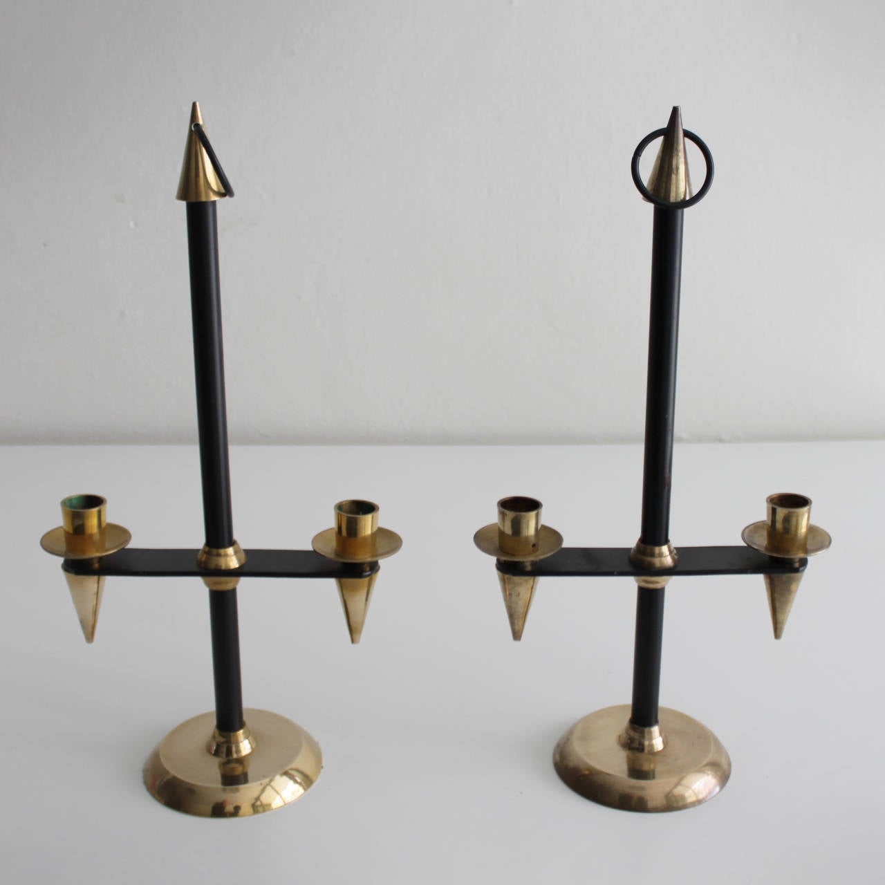 Pair of brass and black enameled candlesticks attributed to Gio Ponti, Italy.
