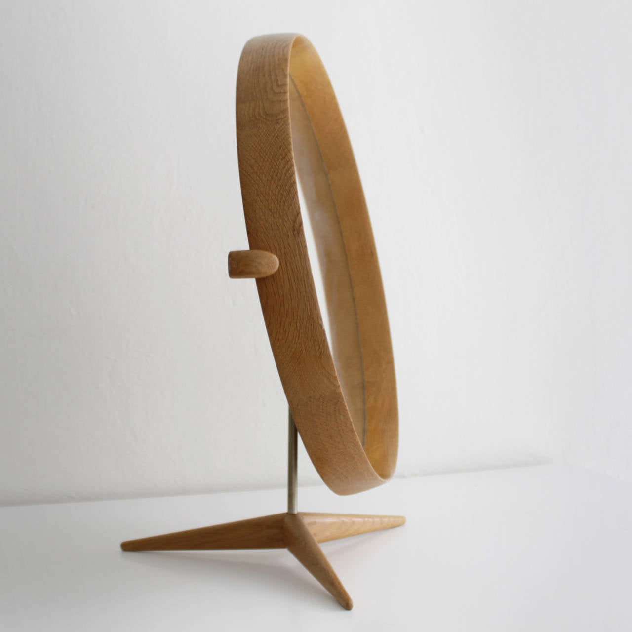 Framed table mirror on a wooden stand by to Uno & Osten Kristiansson for Luxus, Sweden. Nice decorative mirror executed in oak. Good condition.