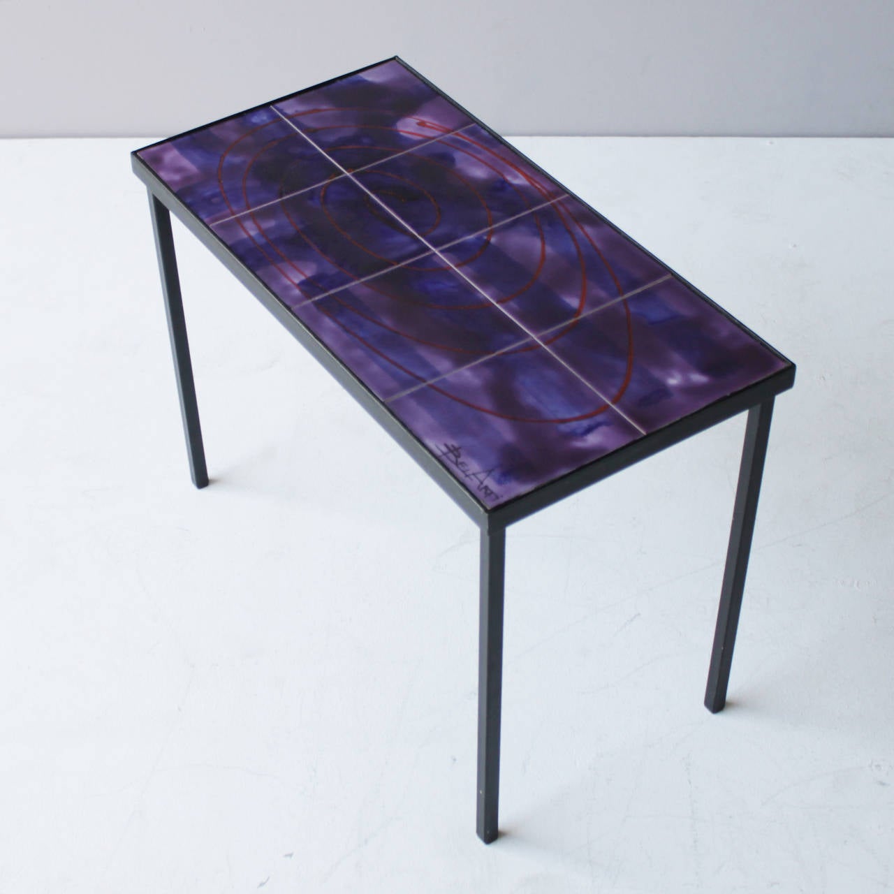 Coffee table or side table with purple glazed tiles from Belgium. Signed Bélarti.
Dimensions: Height: 17.3 in. (44 cm), width: 24.0 in. (61 cm), depth: 12.2 inches (31 cm).