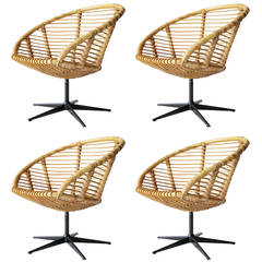 Set of Four Rattan Swivel Chairs in the Style of Franco Albini