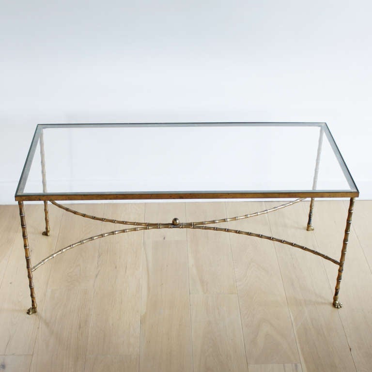 French Faux Bamboo cocktail or coffee table. Patinaed brass frame with solid brass paw feet. New glass top. No marker but given the details it could be Maison Bagues. Beautiful original patiné.