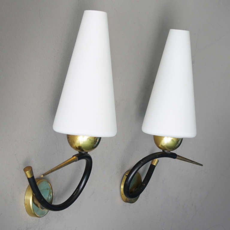 Two rare elegant wall lights by Arlus France. Good, fully original, with new mounting plates (invisible).

Together with companies like Disderot, Lunel and Rispal, the Paris based firm Maison Arlus had a strong influence on the modernization of