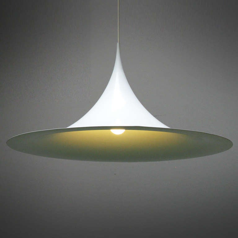 Designed in 1967 by architects Claus Bonderup and Torsten Thorup for Fog & Mørup, Denmark. Labeled. Matte off white enameled shade. This is the large one, diameter 23.6 inches, height 11.8 in.
Literature: 1000 Lights, 1960 to present, Charlotte &