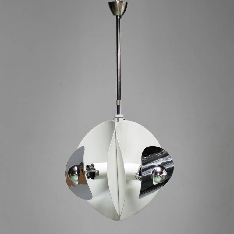 Set of three Italian mirror pendants by Brevettato. White lacquered metal and chrome.
One with three bulbs and the other two with each five-light bulbs.
Dimensions small one with the three bulbs: height ceiling till drop 23.6 in. (60 cm), diameter