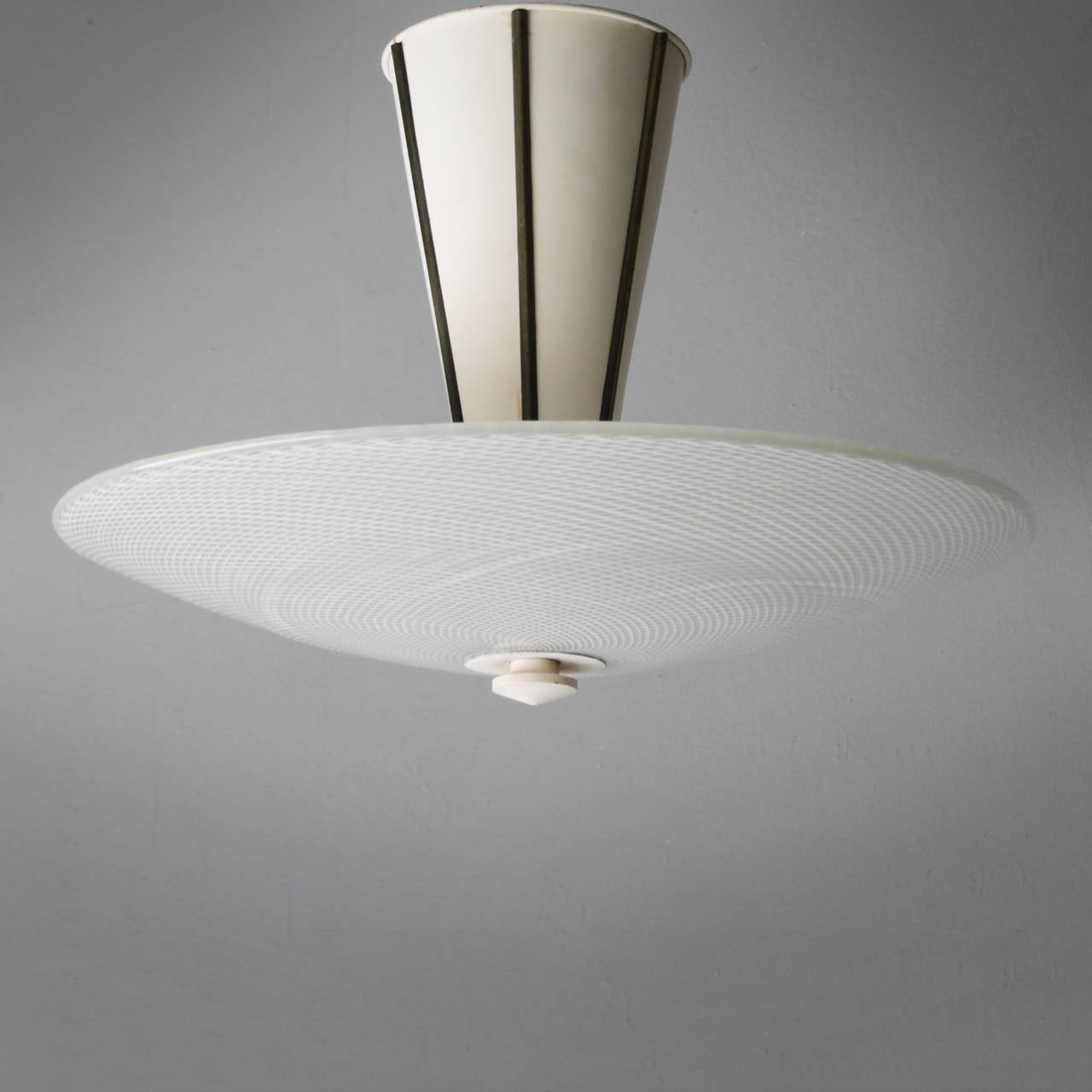 Impressive Italian ceiling light by the famous Murano based company Venini. This ceiling lamp was most likely designed by Tomaso Buzzi (1900-1981), though it does show similarities with lighting designs of Carlo Scarpa as well. The 22 inch (!)