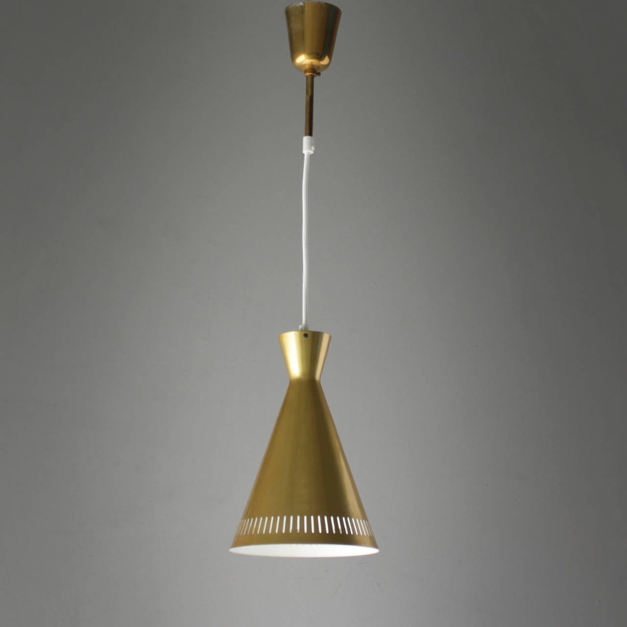 Pair of brass Scandinavian diabolo pendants. Rewired with cotton wire. Measurements fixture: height 10.3 in. (26 cm), diameter: 6.8 inches. (17,3 cm). Length from ceiling till drop:  50 inches (127 cm).